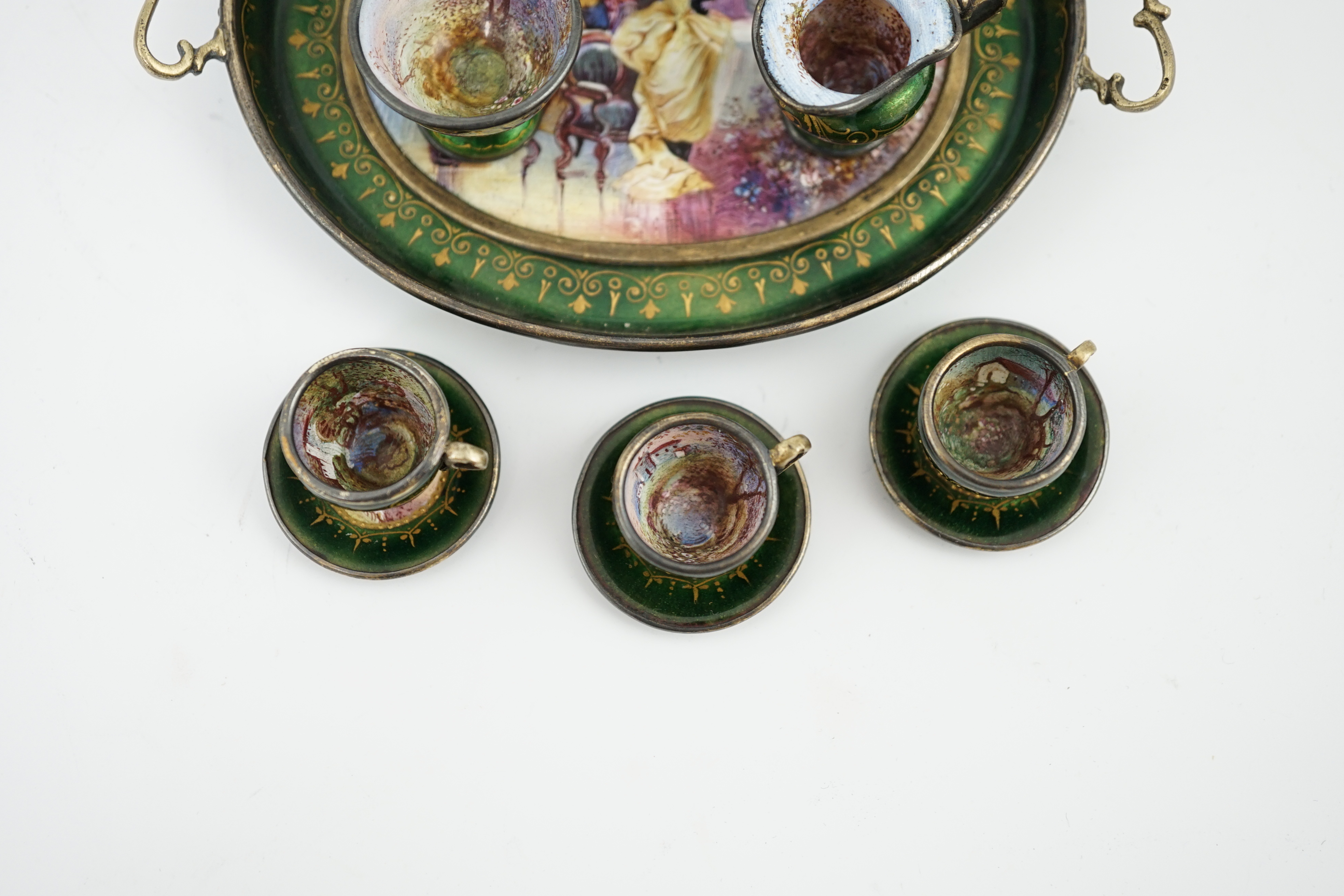 A cased late 19th century Viennese silver and polychrome enamelled miniature thirteen piece tea service, by Ludwig Politzer